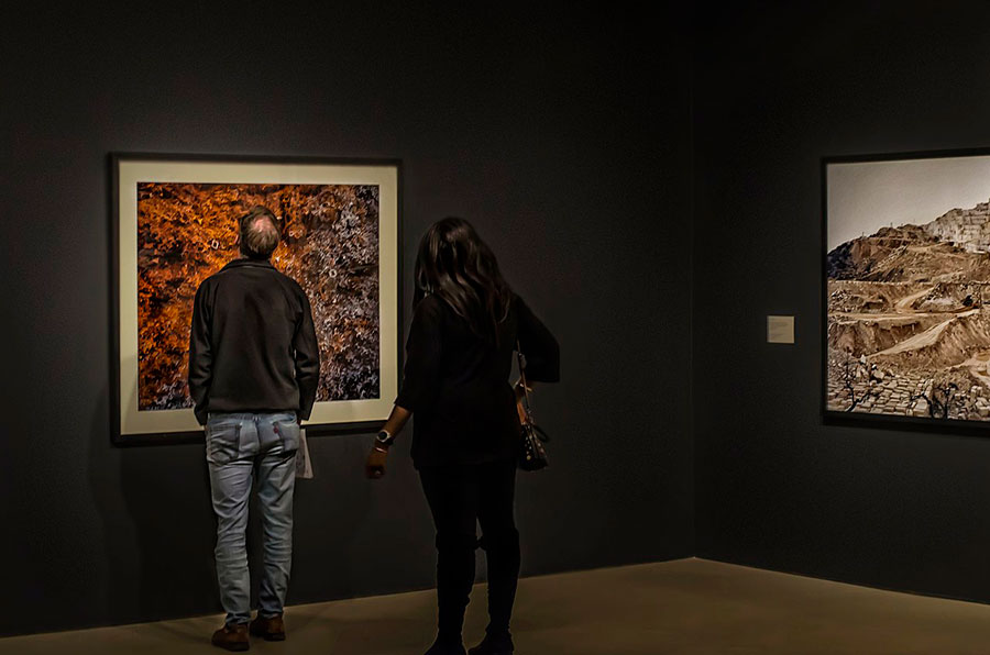 People viewing a Burtynsky show at the Art Gallery of Hamilton